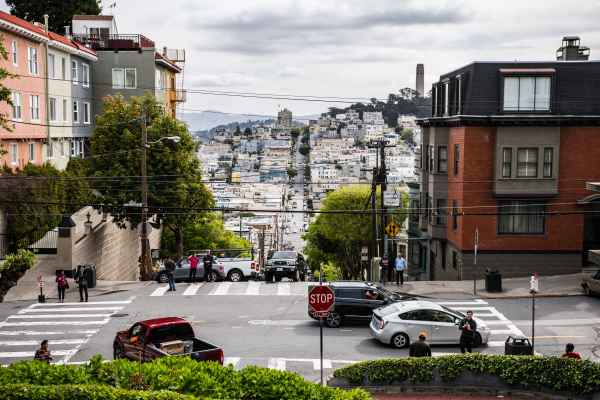 A busy street lined by many homes.